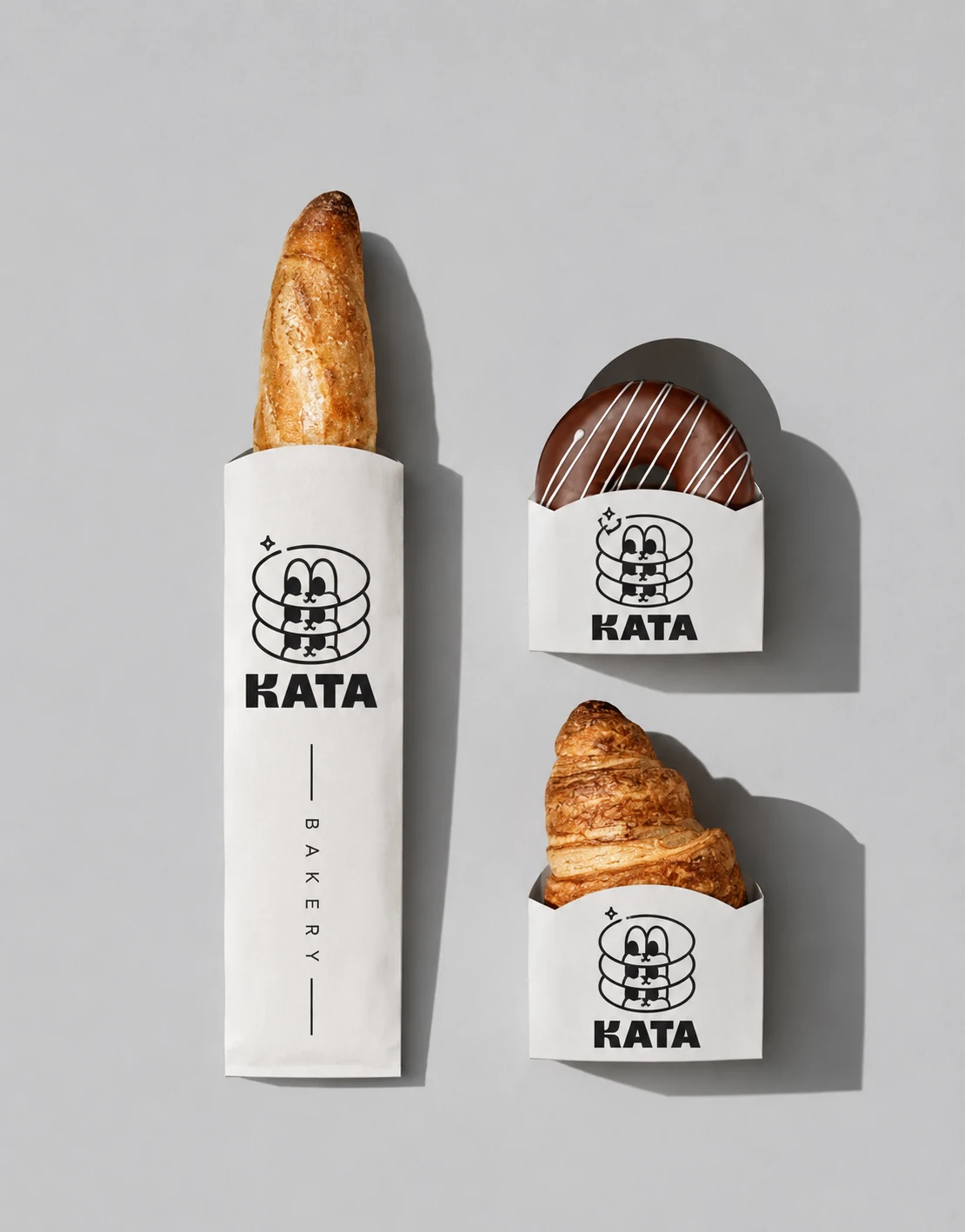 KATA BAKERY pastry sleeves wrapping a baguette and croissants